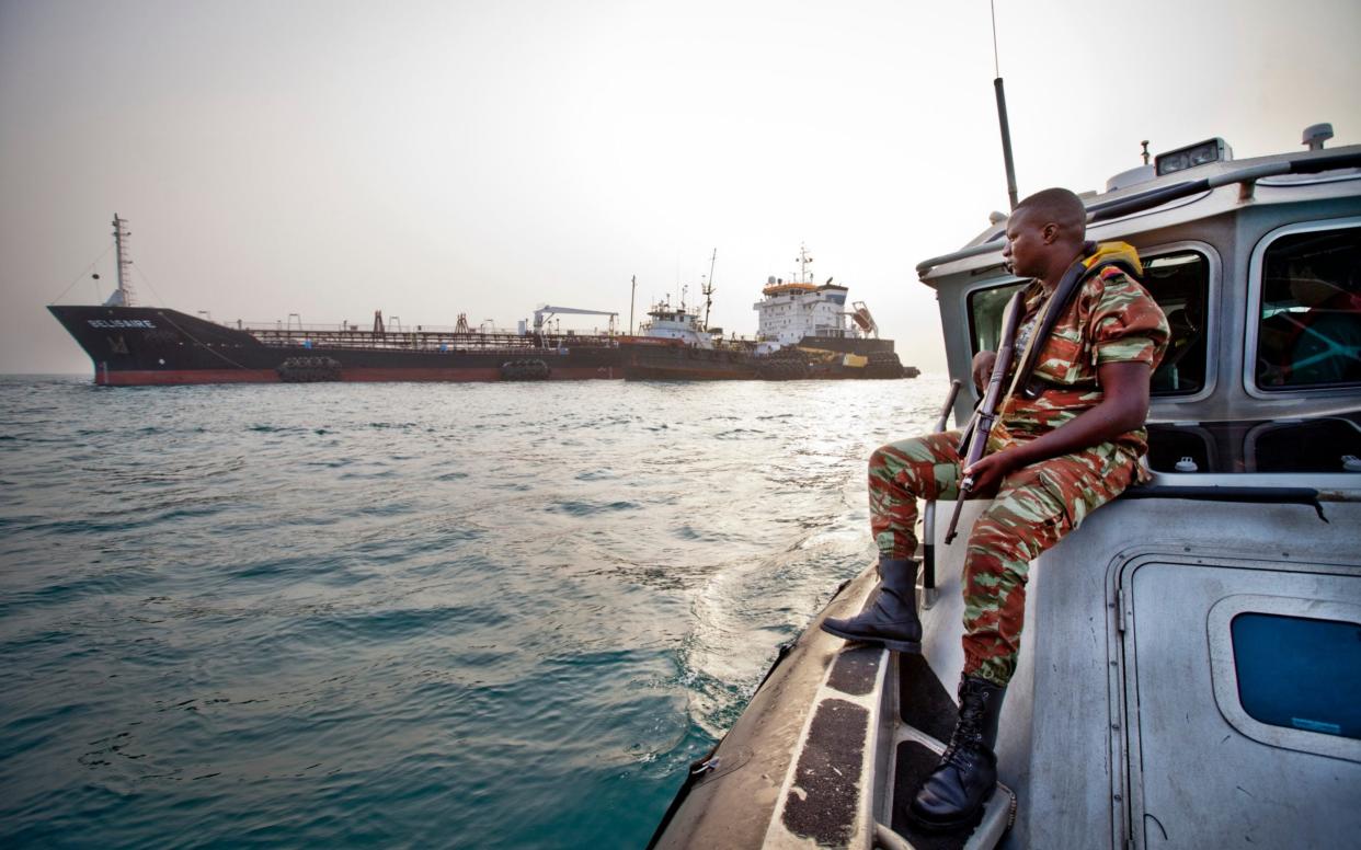 The Benin navy's anti-piracy team ( Force Navale) on on patrol in the Bight of Benin - Jason Florio /Corbis Historical 