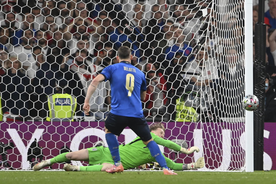 FILE -England's goalkeeper Jordan Pickford saves a penalty shot y Italy's Andrea Belotti during the penalty shootout during the Euro 2020 soccer final match between England and Italy at Wembley stadium in London, Sunday, July 11, 2021. The penalty shootout is a tense battle of wills over 12 yards (11 meters) that has increasingly become a huge part of soccer and an unavoidable feature of the knockout stage in the biggest competitions. (Andy Rain/Pool Photo via AP, File)