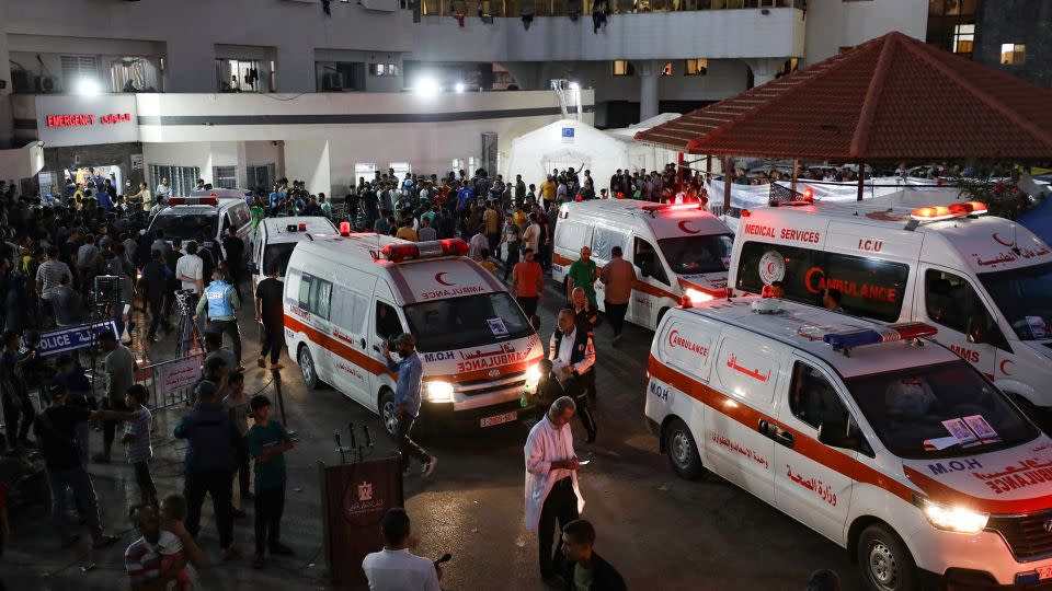 Ambulances carrying victims of Israeli strikes crowd the entrance to the emergency ward of the Al-Shifa hospital in Gaza City on October 15. - Dawood Nemer/AFP/Getty Images