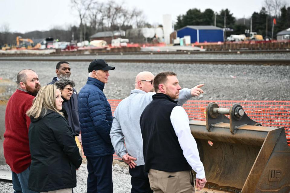 US President Joe Biden (C) receives an operational briefing from officials on the continuing response and recovery efforts at the site of a train derailment which spilled hazardous chemicals a year ago in East Palestine, Ohio on February 16, 2024.