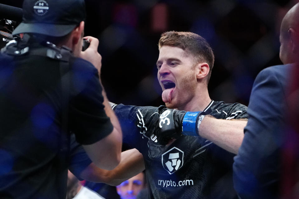 Sep 16, 2023; Las Vegas, Nevada, USA; Charlie Campbell (blue gloves) reacts after defeating Alex Reyes (not pictured) during UFC Fight Night at T-Mobile Arena. Mandatory Credit: Stephen R. Sylvanie-USA TODAY Sports