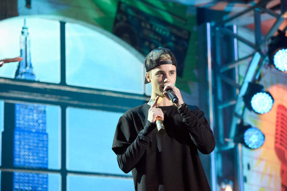 Justin Bieber speaks on stage at the 2015 Nickelodeon HALO Awards at Pier 36 on November 14, 2015 in New York City.  (Photo by Kevin Mazur/Getty Images for Nickelodeon)