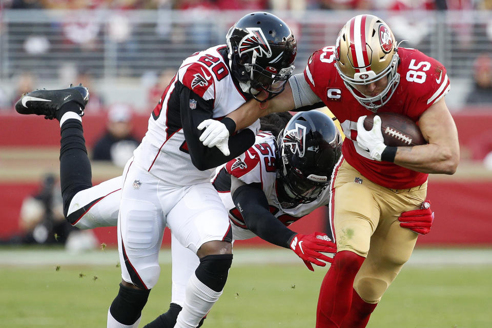 San Francisco 49ers tight end George Kittle (85) runs against Atlanta Falcons defensive back Kendall Sheffield (20) and outside linebacker De'Vondre Campbell (59) during the second half of an NFL football game in Santa Clara, Calif., Sunday, Dec. 15, 2019. (AP Photo/Josie Lepe)