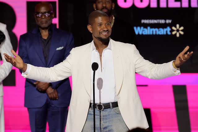 <p>Kevin Winter/Getty</p> Usher accepts the Lifetime Achievement Award onstage during the 2024 BET Awards at Peacock Theater on June 30, 2024 in Los Angeles
