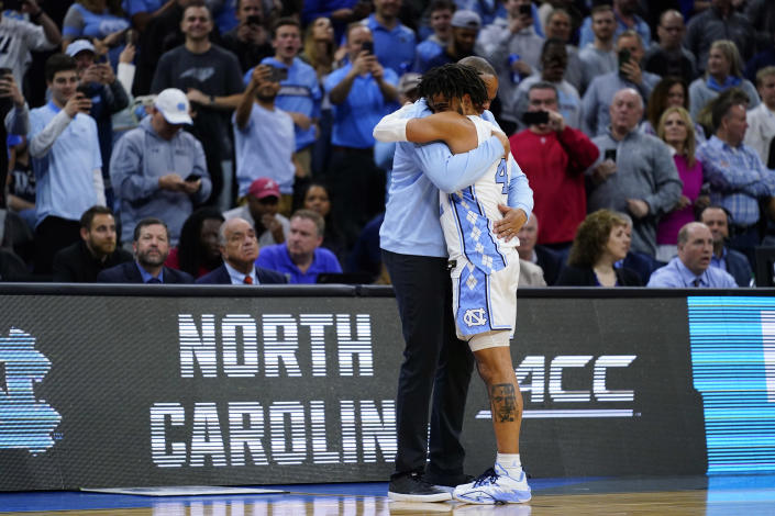 North Carolina's R.J. Davis, right, and Hubert Davis celebrate after a college basketball game against St. Peter's in the Elite 8 round of the NCAA tournament, Sunday, March 27, 2022, in Philadelphia. (AP Photo/Matt Rourke)