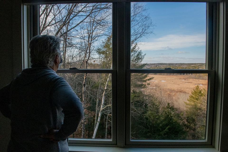 Rep. Patty Hymanson takes in the view of York River in her York, Maine home Jan. 6, 2022.