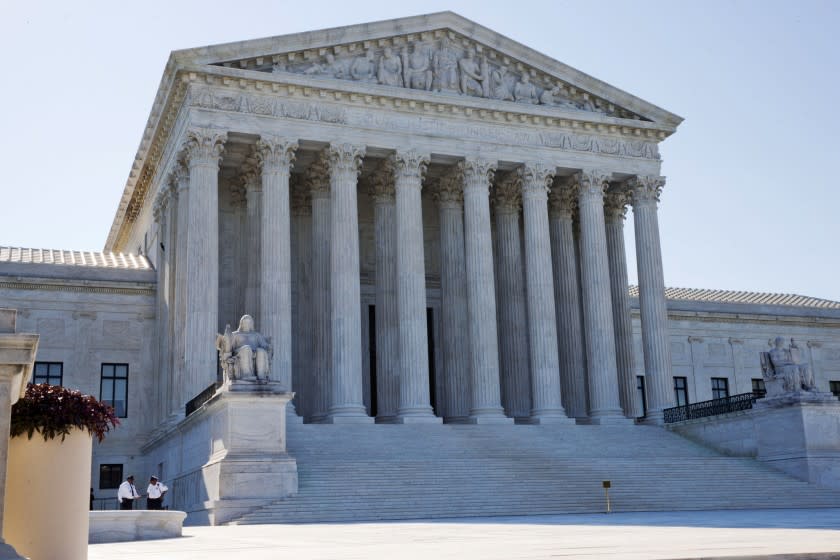 Members of security stand outside of the Supreme Court in Washington, Monday June 29, 2015.