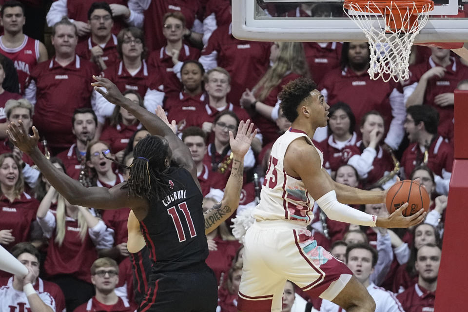 Indiana forward Trayce Jackson-Davis (23) looks to shoot netxt to Rutgers center Clifford Omoruyi (11) during the first half of an NCAA college basketball game Tuesday, Feb. 7, 2023, in Bloomington, Ind. (AP Photo/Darron Cummings)