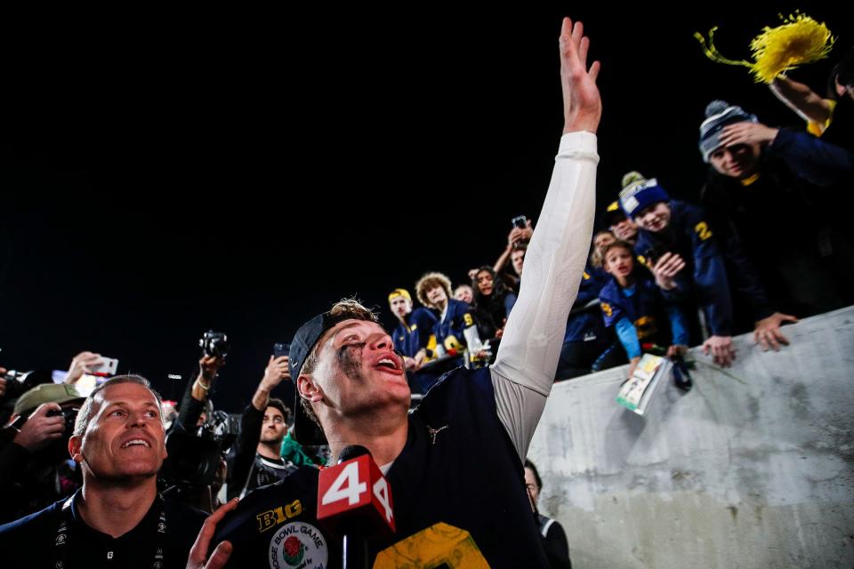 Michigan quarterback J.J. McCarthy (9) waves at fans to celebrate a 27-20 Rose Bowl win over Alabama at the 2024 Rose Bowl in Pasadena, Calif., on Monday, Jan. 1, 2024.