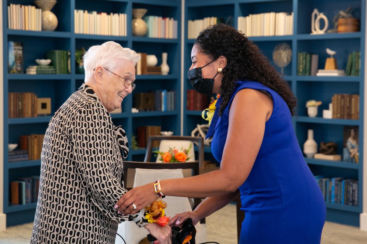 Resident Joyce Pollara, left, and Fatima Feliciano, of East Bridgewater, executive director of Benchmark at Hanover, at the grand opening of the new assisted living residence last week.