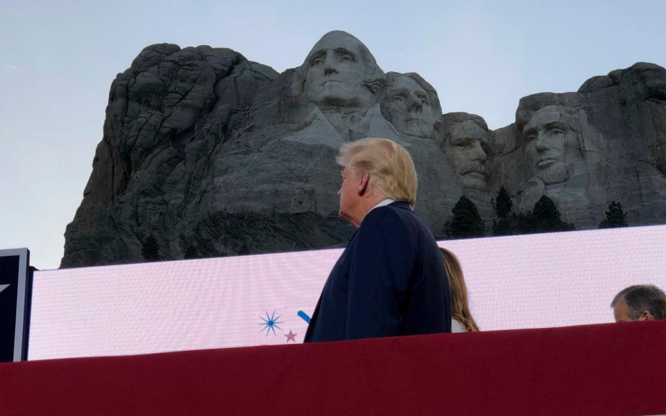 Donald Trump watches planes perform fly-overs of the Mt Rushmore National Monument - AP Photo/Alex Brandon