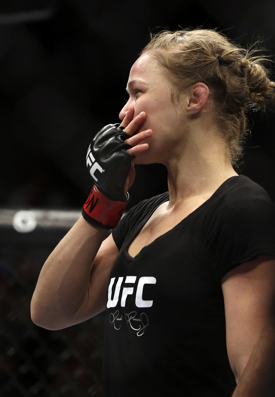 Ronda Rousey blows a kiss to the crowd after defeating Sara McMann in a UFC 170 mixed martial arts women's bantamweight title fight on Saturday, Feb. 22, 2014, in Las Vegas. (AP Photo/Isaac Brekken)