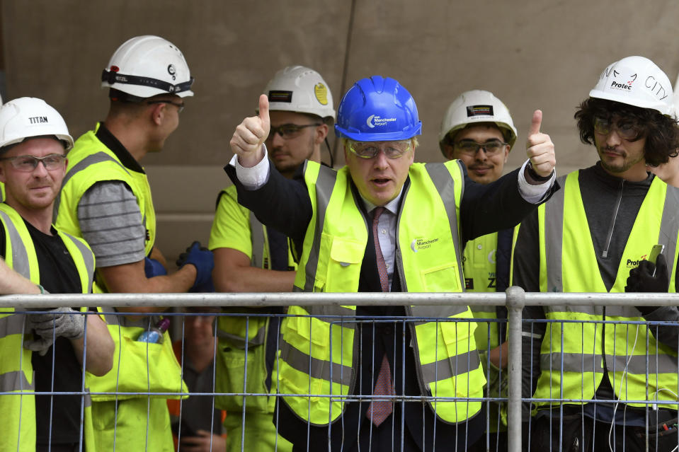 Conservative Party leadership candidate Boris Johnson gestures, during a visit to view the construction work for the expansion of Terminal Two at Manchester Airport, in Manchester, England, Tuesday July 9, 2019. (Stefan Rousseau/Pool Photo via AP)