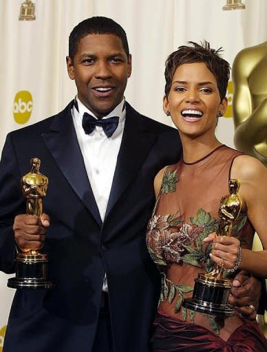 US actor Denzel Washington and actress Halle Berry hold their Oscars after winning, respectively, the award for best actor in "Training Day" and the award for best actress in "Monster's Ball," in 2002. Black actresses Viola Davis and Octavia Spencer are Oscar frontrunners this year, but the reality is that non-whites remain hugely under-represented at the Academy Awards, a new study says