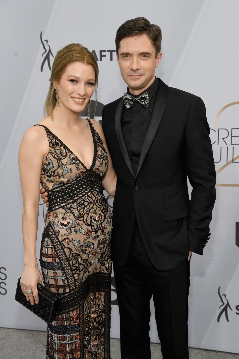 <h1 class="title">Ashley Hinshaw and Topher Grace in Dior Men</h1><cite class="credit">Photo: Getty Images</cite>