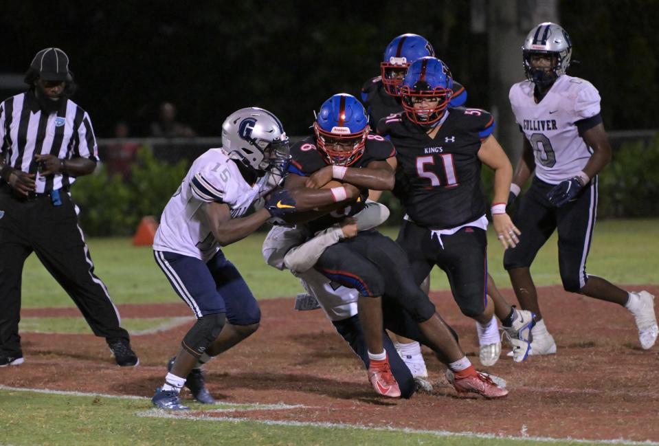 King’s Academy's Marion Victor secures the football as he crosses the goal line for a two-point conversion against Gulliver Prep (Sept. 22, 2023).