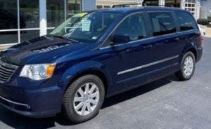 A blue Chrysler Town & Country minivan.