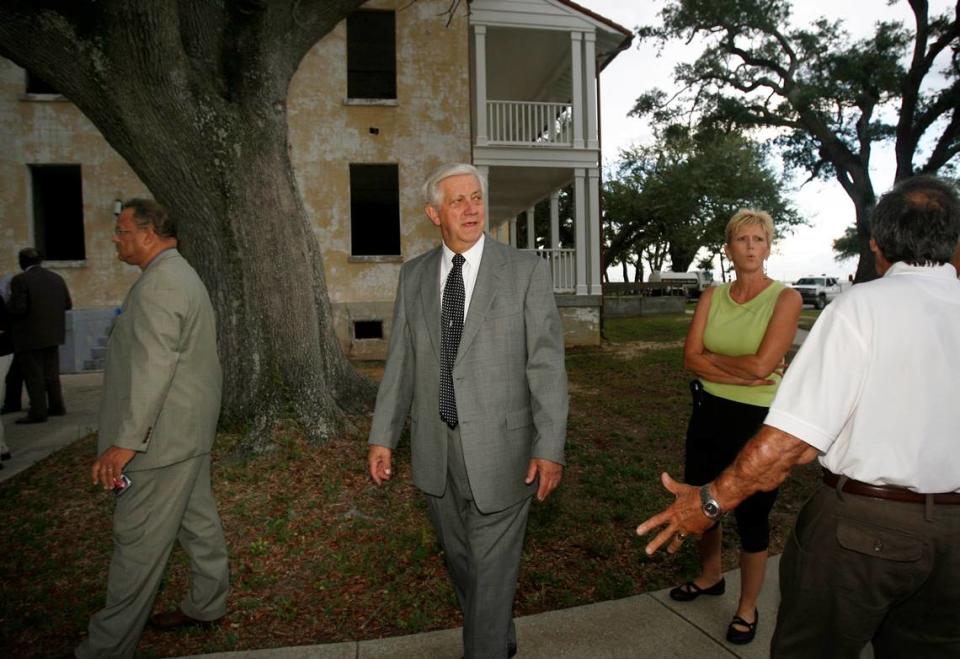 Mayor George Schloegel (center) gives community leaders a tour of the Gulfport VA to show the potential of the property that now is Centennial Plaza resort on U.S. 90.