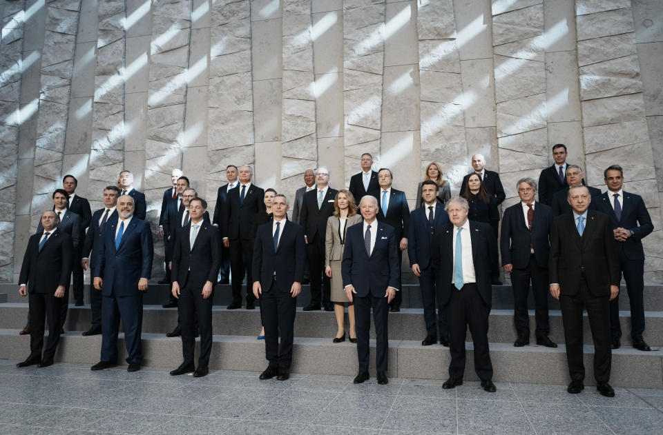 NATO heads of state pose for a group photo during an extraordinary NATO summit at NATO headquarters in Brussels, Thursday, March 24, 2022. As the war in Ukraine grinds into a second month, President Joe Biden and Western allies are gathering to chart a path to ramp up pressure on Russian President Vladimir Putin while tending to the economic and security fallout that's spreading across Europe and the world. (AP Photo/Thibault Camus)