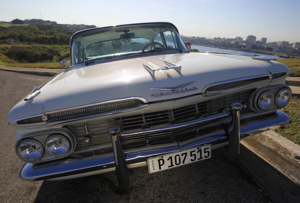 A 1959 Chevrolet Impala car is parked in Havana December 23, 2014. Around 60,000 vintage cars have run on Cuba's roads since before the 1959 revolution led by Fidel Castro, but finding a collectible of value is a challenge. For every hidden gem, there are thousands of beaten up clunkers, largely stripped of their original parts. Picture taken December 23, 2014. To match Feature CUBA-USA/AUTOS REUTERS/Enrique De La Osa (CUBA - Tags: SOCIETY TRANSPORT BUSINESS)