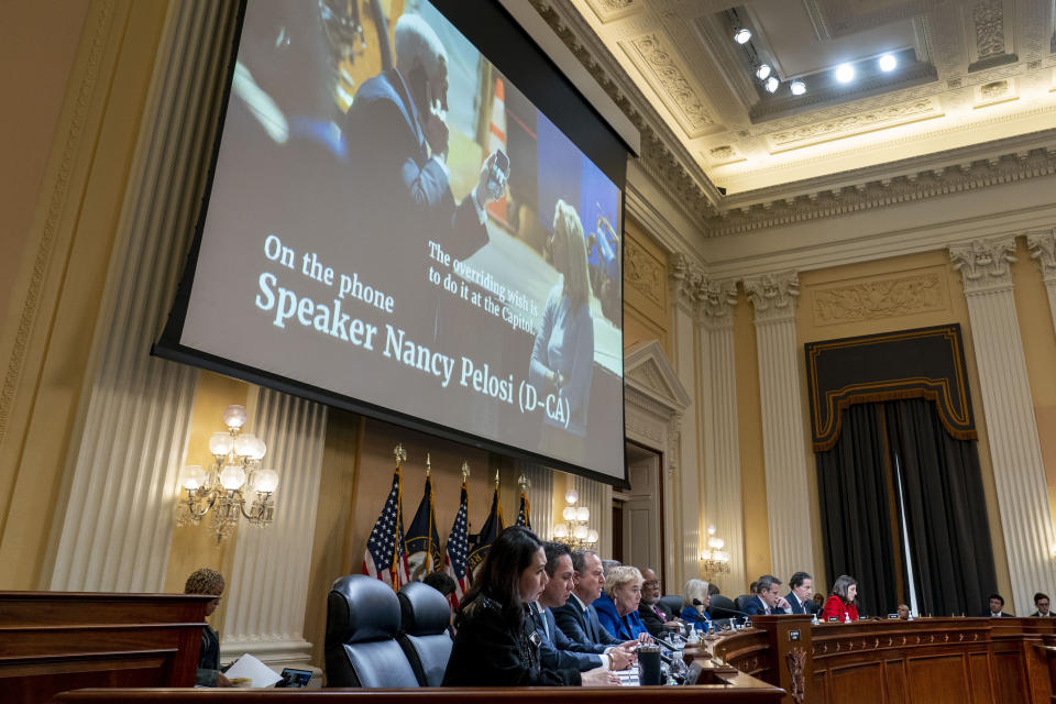 FILE - An image of then-Vice President Mike Pence is displayed as video of House Speaker Nancy Pelosi of Calif., then-Senate Minority Leader Chuck Schumer of N.Y., and other congressional leadership during the breach of the U.S. Capitol building on Jan. 6, 2021, is played as the House select committee investigating the Jan. 6 attack on the U.S. Capitol holds a hearing on Capitol Hill in Washington, Thursday, Oct. 13, 2022. The committee is still talking to lawyers for former Vice President Mike Pence, as it has been for months. But it is unclear whether the lawmakers will subpoena the vice president or ask him for testimony. (AP Photo/Andrew Harnik, Pool, File)