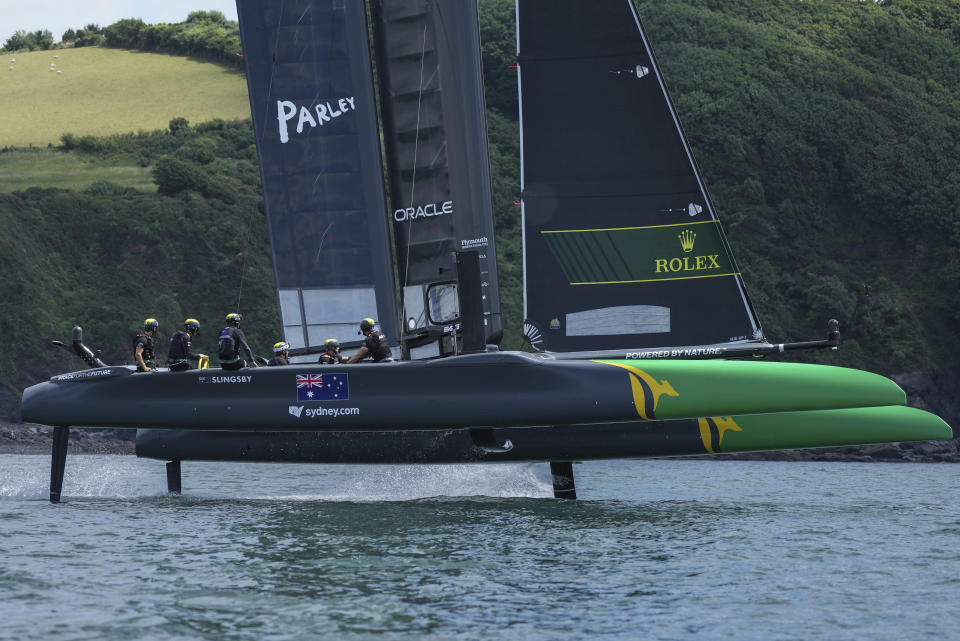 In this photo provided by SailGP, the Australia SailGP Team helmed by Tom Slingsby practices on the water in Plymouth, England, on July 14, 2021. The SailGP global road show touches down in Old Blighty this weekend, giving Britain's Paul Goodison the opportunity to sail in front of home crowds for the first time since the 2012 London Olympics. The regatta on Plymouth Sound will also give Slingsby the chance to bounce back from a last-place performance in the previous regatta, an unthinkable finish for the crack team that claimed the $1 million, winner-take-all prize during the inaugural season of 2019. (Thomas Lovelock/SailGP via AP)