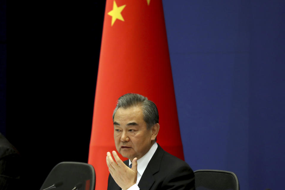 Chinese Foreign Minister Wang Yi answers media questions during a press conference on the upcoming Road and Belt Forum in Beijing on Friday, April 19, 2019. China is downplaying the political implications of its global development campaign known as the Belt and Road initiative, saying that it aims to boost multilateralism amid protectionist trends in the U.S. and elsewhere. (AP Photo/Ng Han Guan)