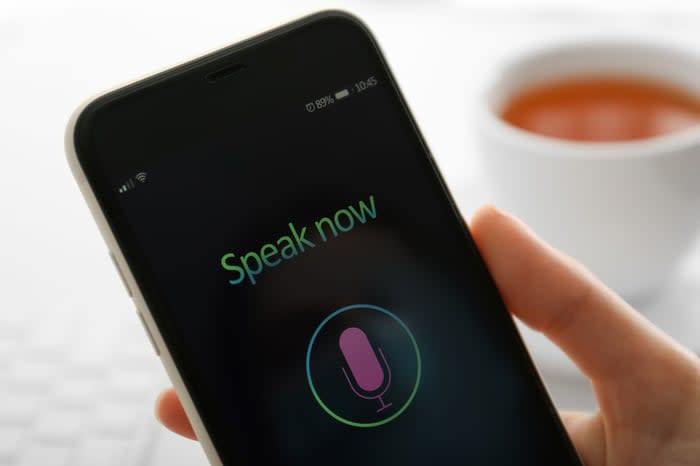 Smartphone screen displaying a microphone icon and the words Speak Now.