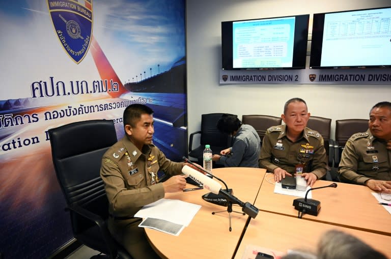 Thai immigration chief Surachet Hakparn (L) made an abrupt about-face more than 24 hours after Qunun landed