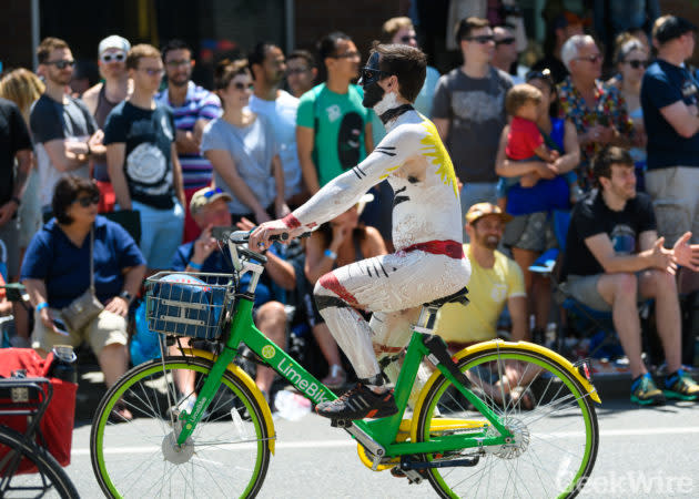 Naked cyclists have always been a thing at the annual Fremont Solstice Parade in Seattle. But the rise of bike sharing in the city added a new twist to the quirky event and provided GeekWire with some real braking nudes. (GeekWire Photo / Kevin Lisota) <a href="https://www.geekwire.com/2018/braking-nudes-seattles-naked-solstice-cyclists-use-spin-ofo-limebike-new-bike-baring-tradition/" rel="nofollow noopener" target="_blank" data-ylk="slk:Read the story.;elm:context_link;itc:0;sec:content-canvas" class="link "><strong>Read the story.</strong></a>