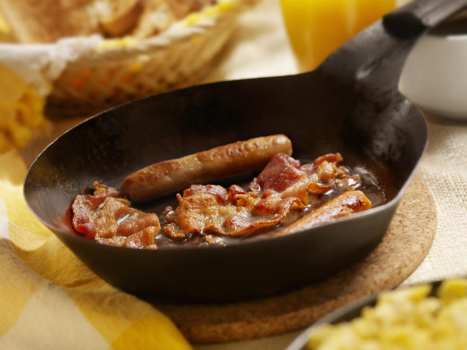 Bacon and Sausages with Scrambled Eggs and Toast.