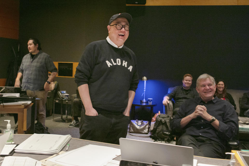 FILE - This image released by Disney-Pixar shows director Peter Sohn, center, at a scoring session for the film "Elemental" at Fox Studios on March 1, 2023 in Los Angeles. (Photo by Deborah Coleman / Pixar)