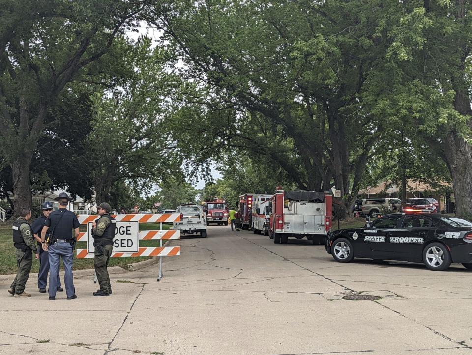 Barricades block off a portion of Elm Street in Laurel, Neb., Thursday, Aug. 4, 2022. The Nebraska State Patrol is investigating a situation with multiple fatalities that occurred in Laurel on Thursday morning. Emergency personnel from the state patrol, Belden and the Cedar County Sheriff's Department were working in the area. (Riley Tolan-Keig/The Norfolk Daily News via AP)