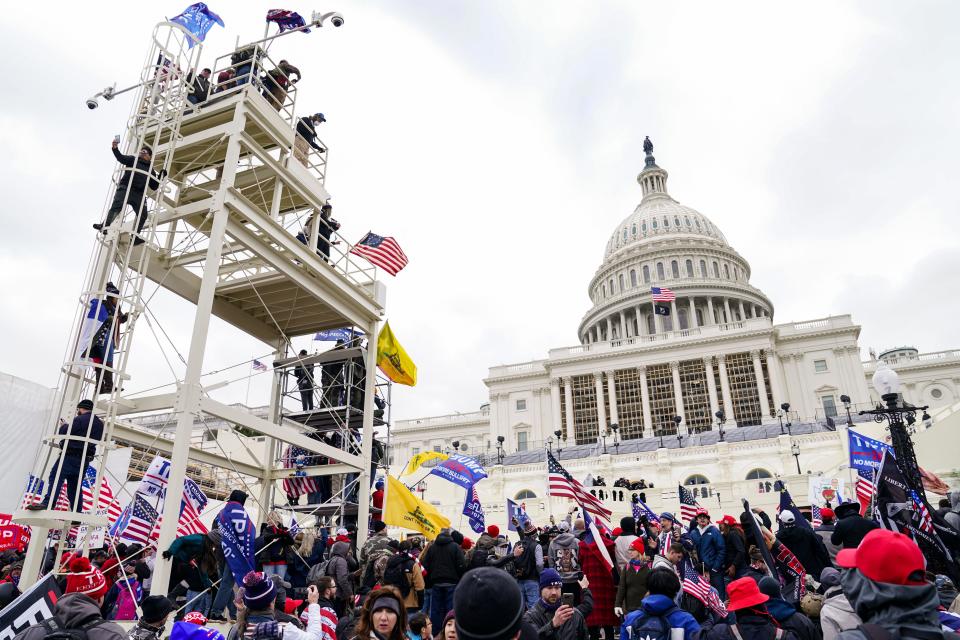 Insurrectionists loyal to President Donald Trump breach the U.S. Capitol in Washington, Jan. 6, 2021.