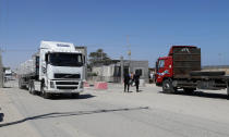 A truck carrying rice enters Gaza at the Kerem Shalom cargo crossing with Israel, in Rafah, southern Gaza Strip, Monday, June 21, 2021. Israel on Monday eased some restrictions on the Gaza Strip that have threatened a fragile cease-fire which halted an 11-day war last month with the territory's Hamas rulers, Palestinian officials said. (AP Photo/Adel Hana)