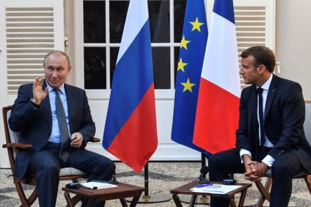 French President Emmanuel Macron meets with Russia's President Vladimir Putin, at his summer retreat of the Bregancon fortress on the Mediterranean coast, near the village of Bormes-les-Mimosas