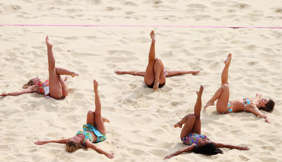 Cheerleaders perform during Women's Beach Volleyball match between China and Russia on Day 1 of the London 2012 Olympic Games at Horse Guards Parade on July 28, 2012 in London, England. (Ryan Pierse/Getty Images)
