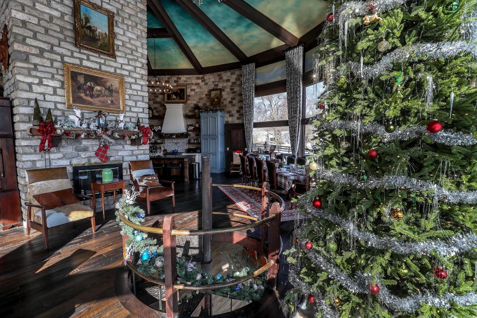 The great room at Roundhouse Farm.  The floors are made from reclaimed barn wood.  The chimney is made from old road pavers from England.  The circular staircase leads to a lower level.November 11, 2019