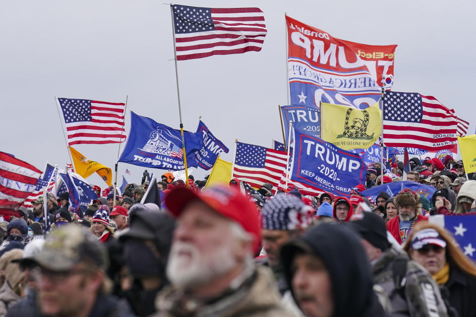 FILE - Trump supporters participate in a rally in Washington, Jan. 6, 2021, that some blame for fueling the attack on the U.S. Capitol. The fate of former President Donald Trump’s attempt to return to the White House is in the U.S. Supreme Court’s hands. On Thursday, the justices will hear arguments in Trump’s appeal of a Colorado Supreme Court ruling that he is not eligible to run again for president because he violated a provision in the 14th Amendment preventing those who “engaged in insurrection” from holding office. (AP Photo/John Minchillo, File)