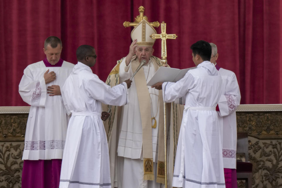 Pope Francis delivers his blessing as he celebrates a mass for the canonization of two new saints, Giovanni Battista Scalabrini and Artemide Zatti, in St. Peter's Square at the Vatican, Sunday, Oct. 9, 2022. (AP Photo/Andrew Medichini)