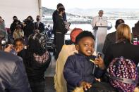 Pope Francis speaks during a ceremony at the Karatepe refugee camp, on the northeastern Aegean island of Lesbos, Greece, Sunday, Dec. 5, 2021. Pope Francis is offering comfort migrants at a refugee camp on the Greek island of Lesbos. He is blasting what he says is the indifference and self-interest shown by Europe "that condemns to death those on the fringes." (Louisa Gouliamaki/Pool via AP)