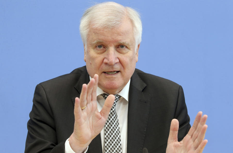 German Interior minister Horst Seehofer gestures as he attends a news conference in Berlin, Germany, Tuesday, May 14, 2019. German security officials say the number of anti-Semitic and anti-foreigner incidents rose in the country last year, despite an overall fall in politically motivated crimes. (Wolfgang Kumm/dpa via AP)