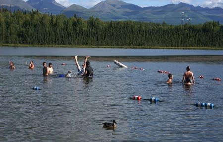 Swimmers cool off at Goose Lake in Anchorage