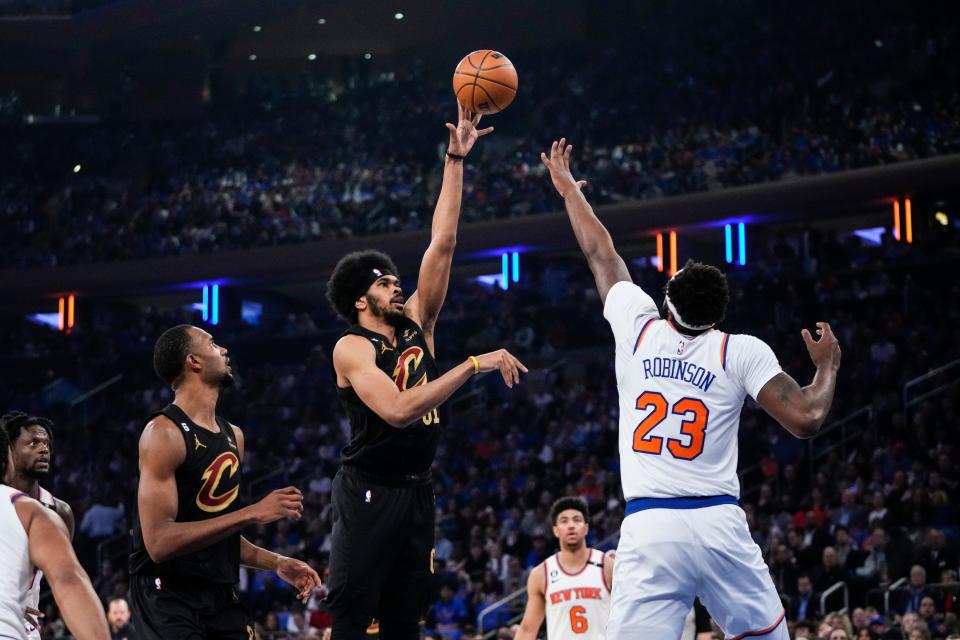 Cavaliers center Jarrett Allen shoots over Mitchell Robinson of the Knicks during the first half of Game 3 a first-round NBA playoff series, Friday, April 21, 2023, in New York.