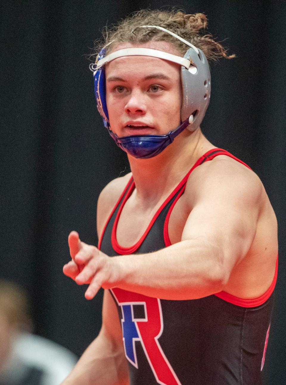 Kody Glithero, Roncalli High School, winner of this 152 bout, listens to an official during a break in the action against Aidan Costello of Hobart, Indianapolis, at Gainbridge Fieldhouse, Friday, Feb. 18, 2022, during the preliminary round of the IHSAA wrestling state finals. 