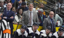 Colorado Avalanche head coach Jared Bednar, top center, looks on with assistant coach Ray Bennet, upper right, and Nolan Pratt, upper left, in the second period of an NHL hockey game against the Winnipeg Jets, Saturday, April 13, 2024, in Denver. (AP Photo/David Zalubowski)