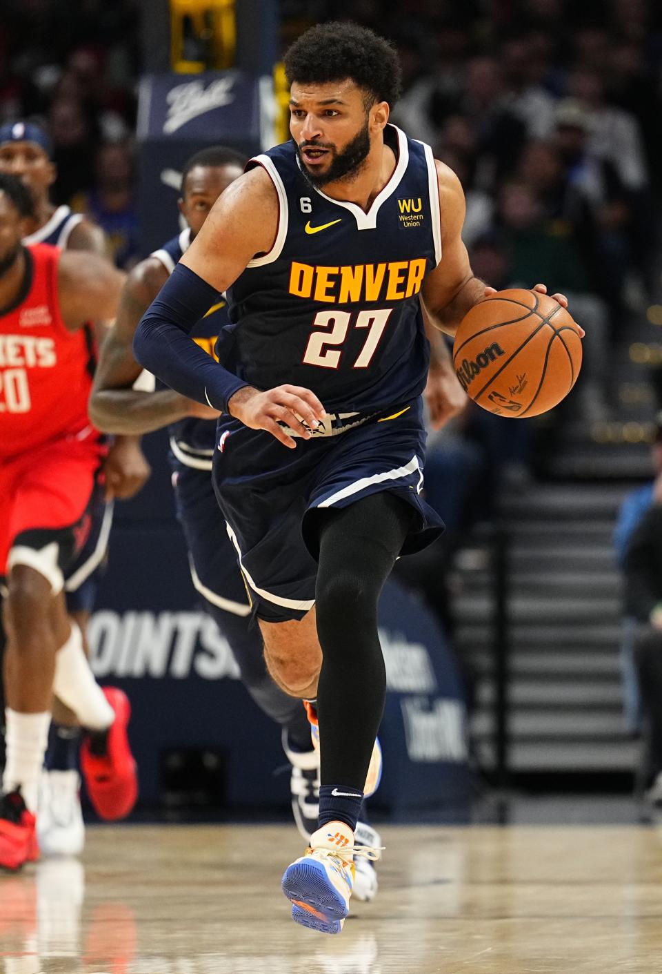 Denver Nuggets guard Jamal Murray brings the ball upcourt against the Houston Rockets during the third quarter of an NBA basketball game, Monday, Nov. 28, 2022, in Denver. (AP Photo/Jack Dempsey)