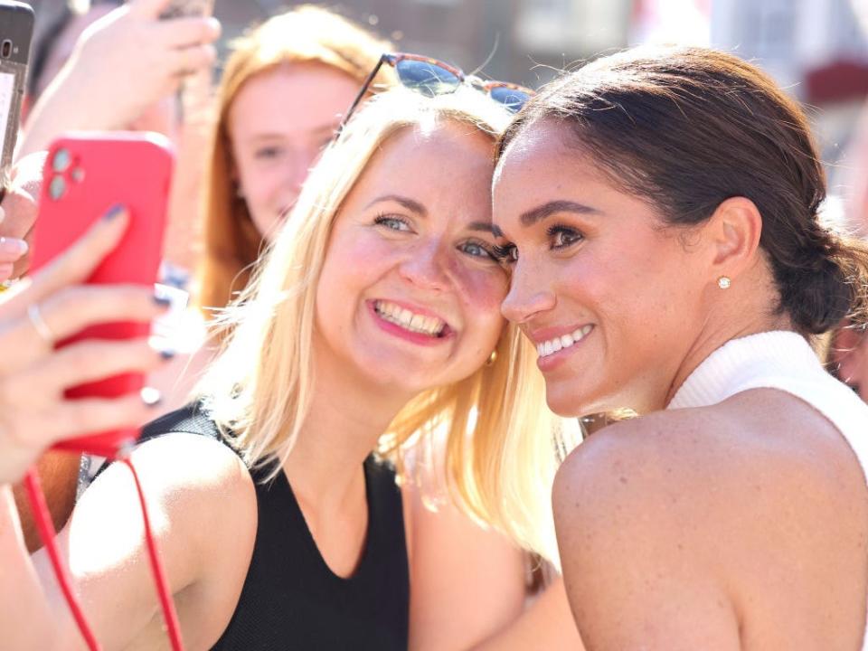 Meghan Markle takes a selfie with a fan at the Invictus Games