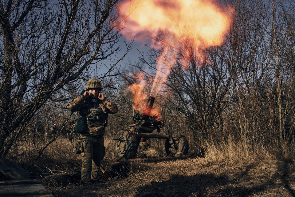 FILE - Ukrainian soldiers fire French MO-120-RT-61 120 mm rifled towed mortar at Russian positions in the frontline near Bakhmut, Donetsk region, Ukraine, Tuesday, Dec. 6, 2022. With the war in Ukraine grinding through its 10th month, both sides are locked in a stalemated battle of attrition, which could set the stage for a new round of escalation. (AP Photo/LIBKOS, File)