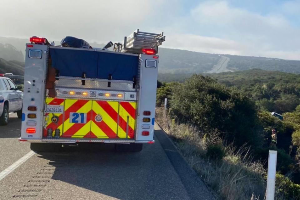 A child was killed and three other people were injured Wednesday, Sept. 28, 2022, in a rollover crash on Highway 1 near Lompoc. The vehicle, center right in photo, ended up off the highway in heavy brush.
